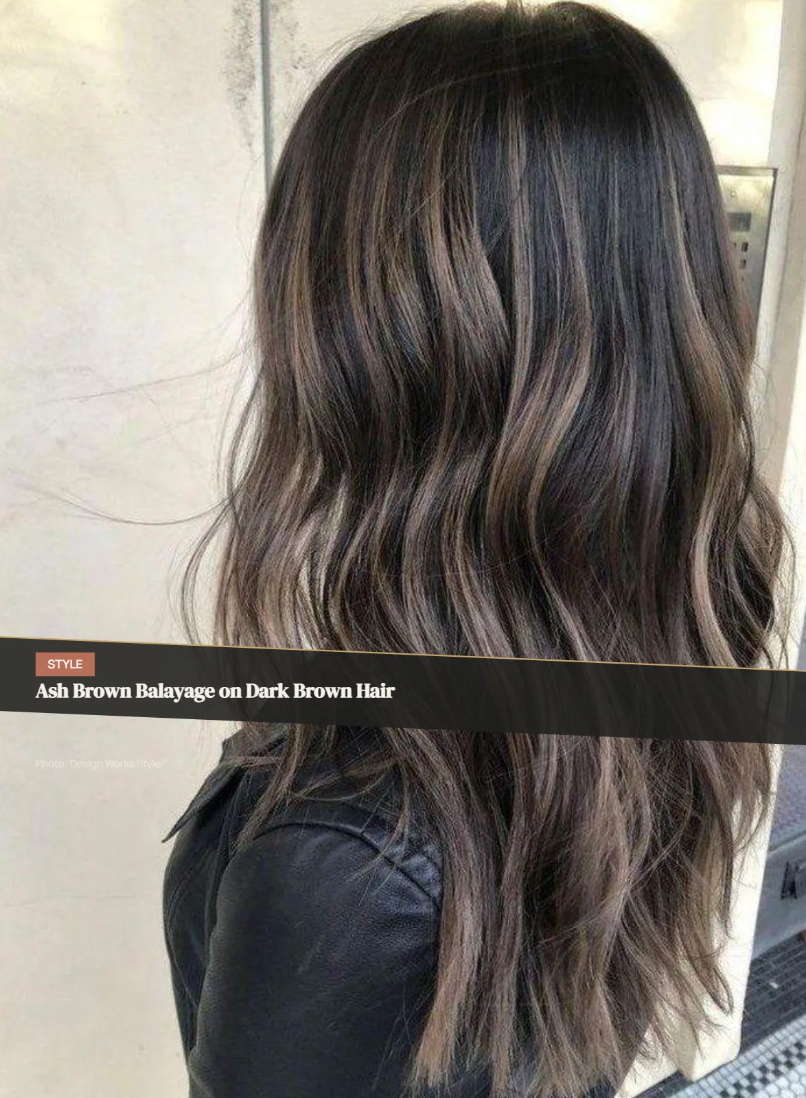 Dark brown hair with subtle cool ash-brown balayage pieces through the lengths