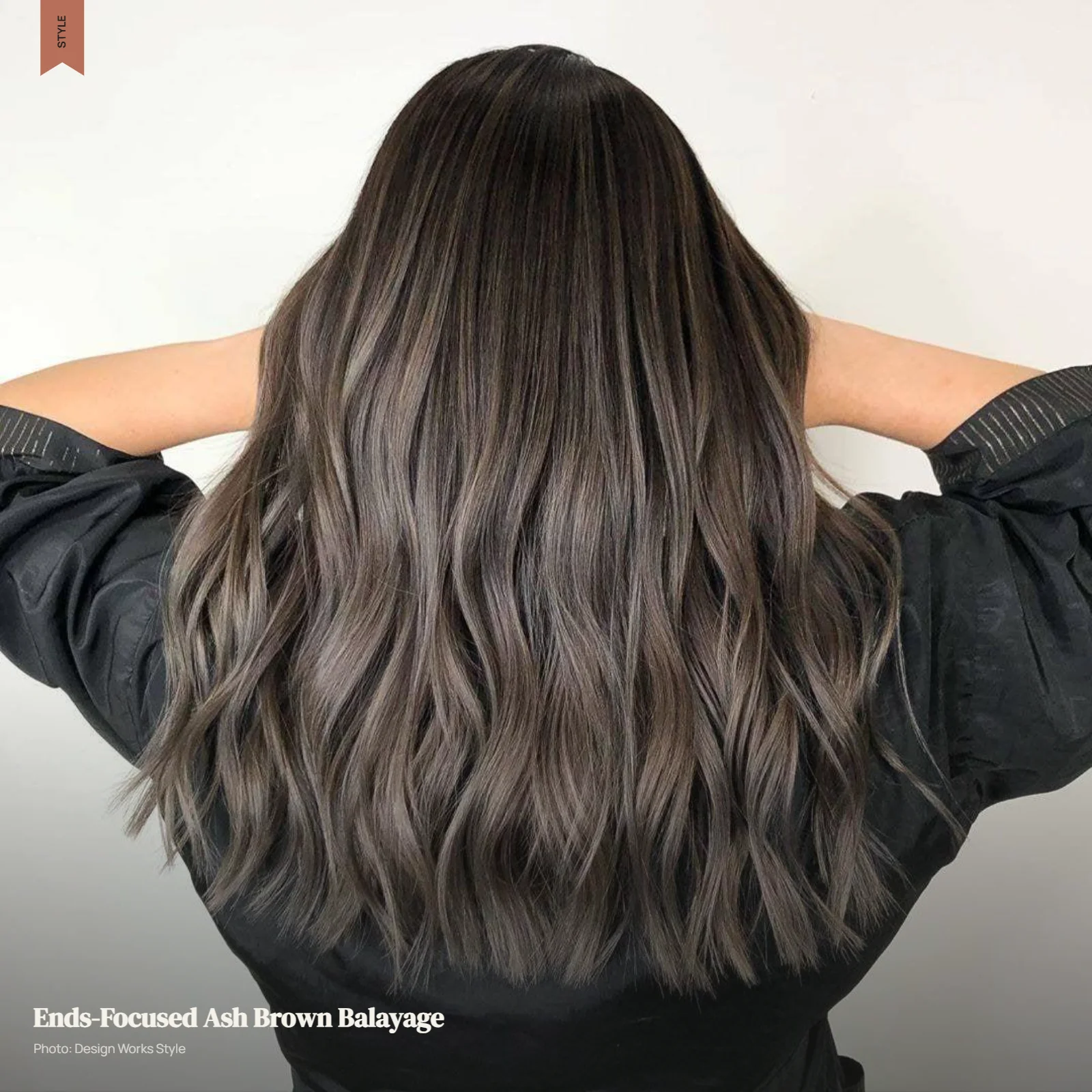 Dark brunette hair with ash brown balayage becoming more visible toward the ends
