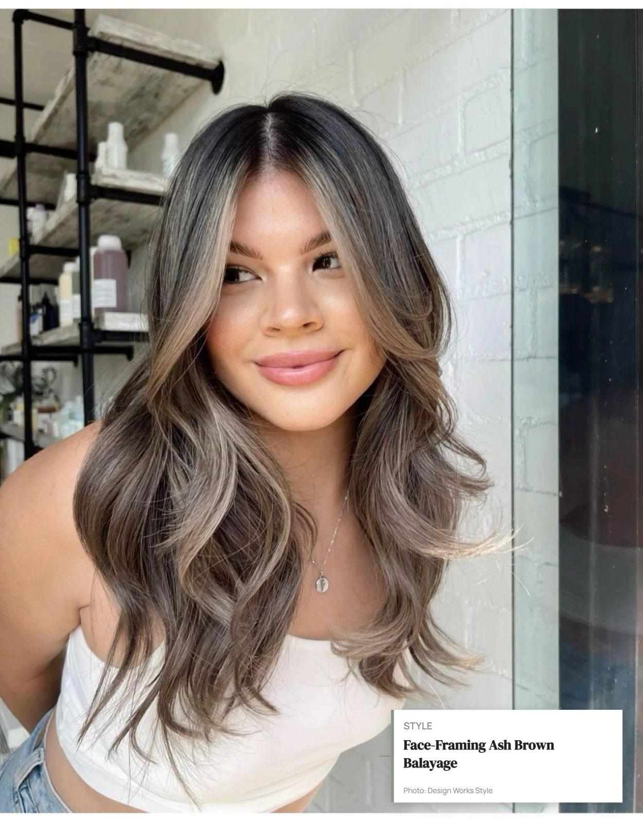 Cool ash brown balayage pieces concentrated around the face on brunette hair