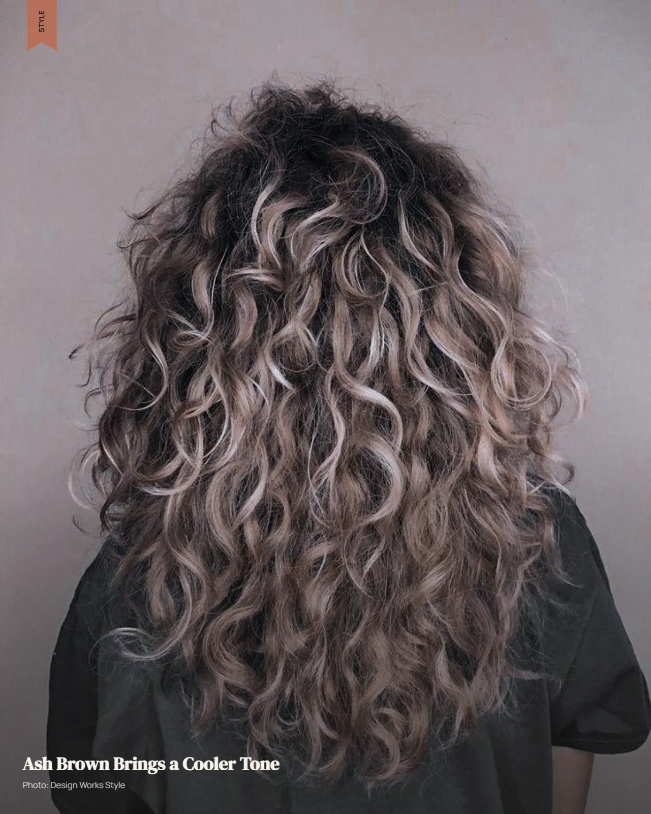 Curly brown hair with muted ash-brown balayage pieces in cooler tones