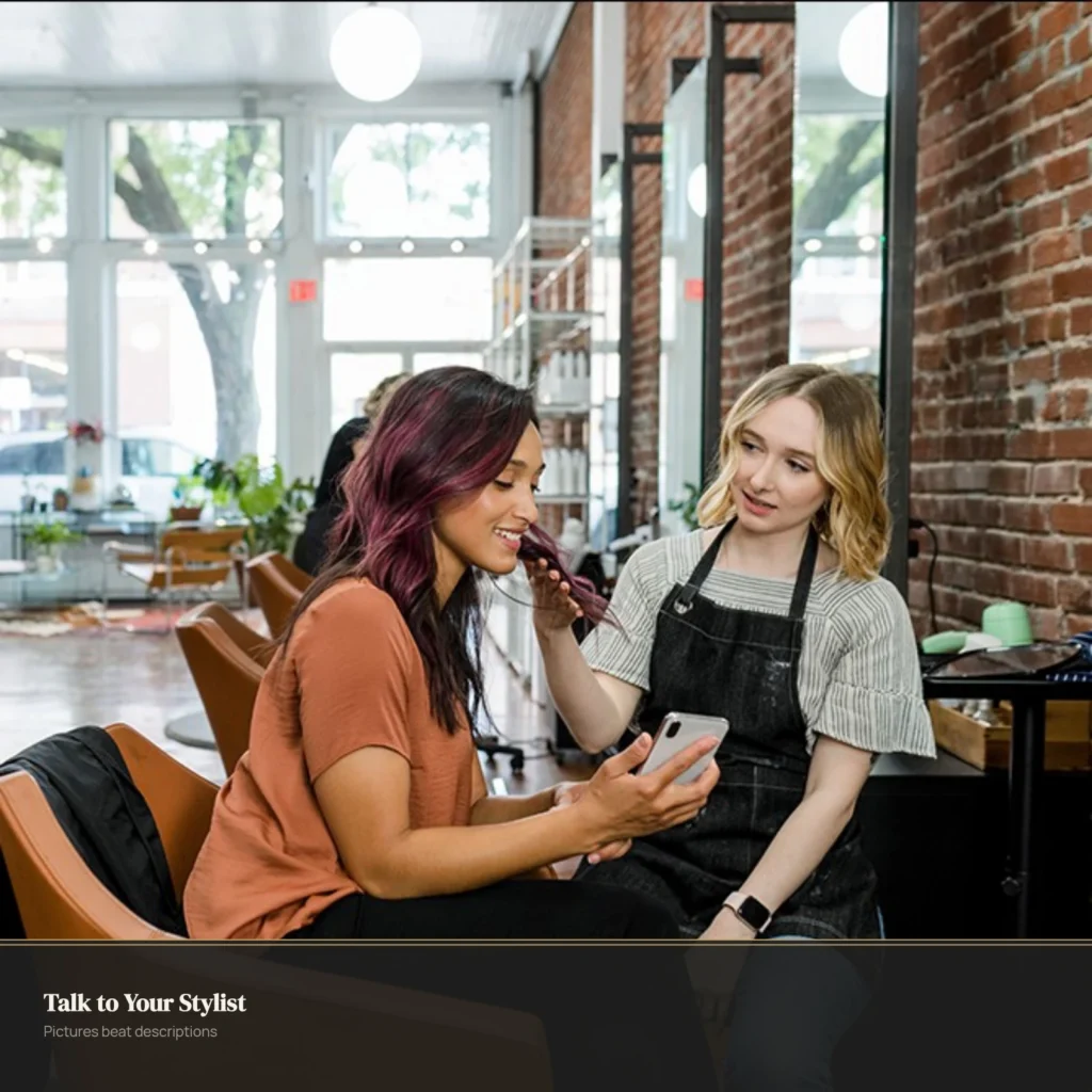 Client showing reference photos during salon consultation