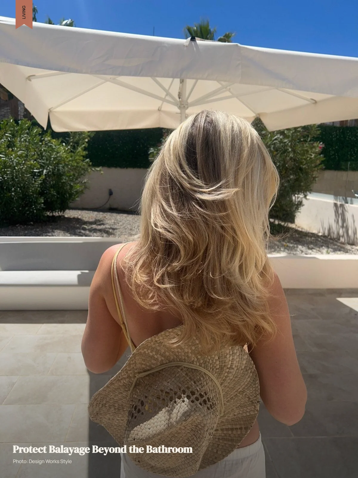Balayage hair with lighter pieces visible in strong sunlight beside a swimming pool