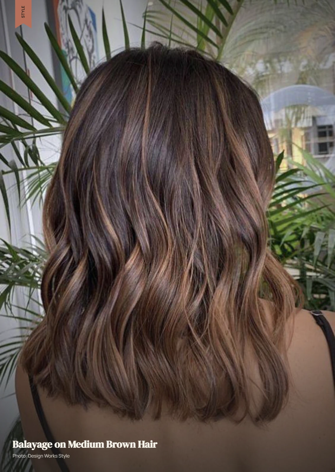 Medium brown hair with lighter balayage pieces creating dimension through the mid-lengths