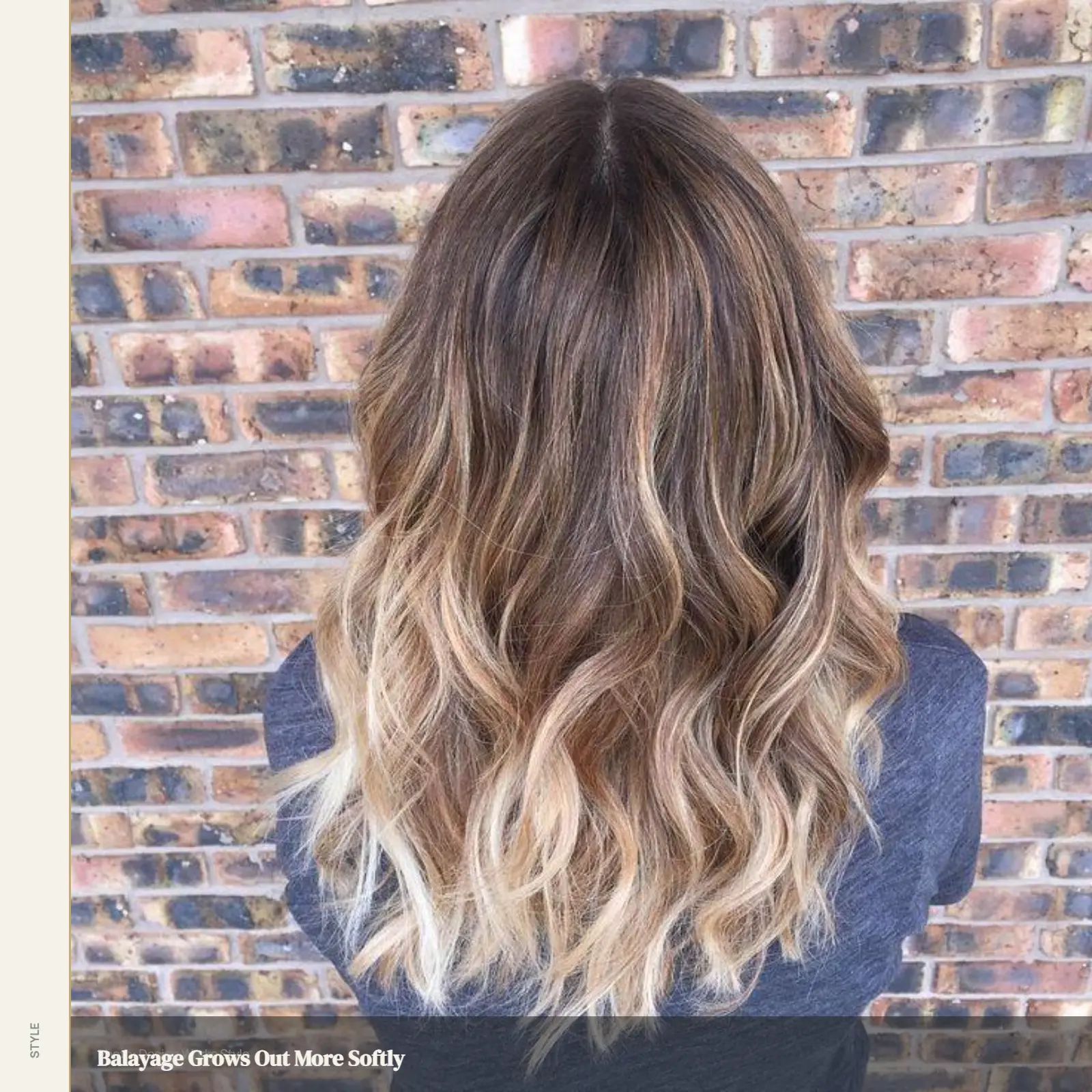 Balayage with darker roots blending gradually into lighter wavy lengths and ends