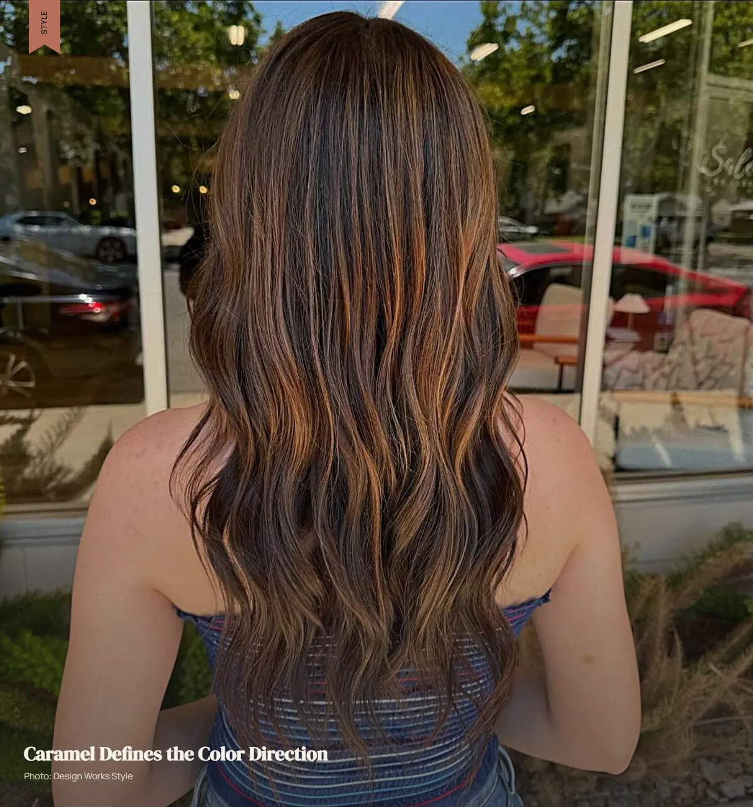 Brown hair with warm caramel ribbons blended selectively through the lengths