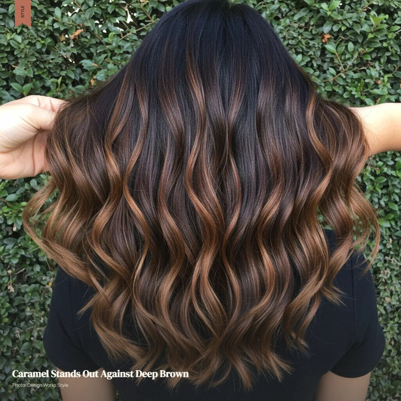 Dark brown hair with visible caramel balayage ribbons creating warm contrast through the waves