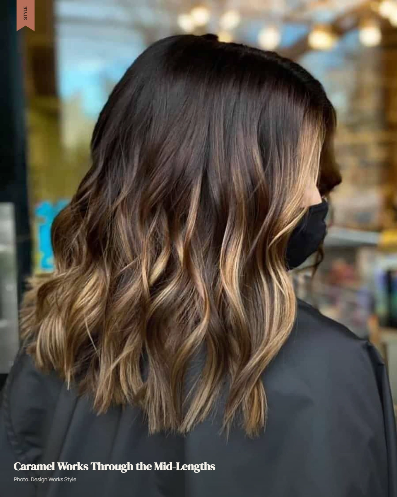 Dark brown hair with caramel balayage concentrated through the mid-lengths