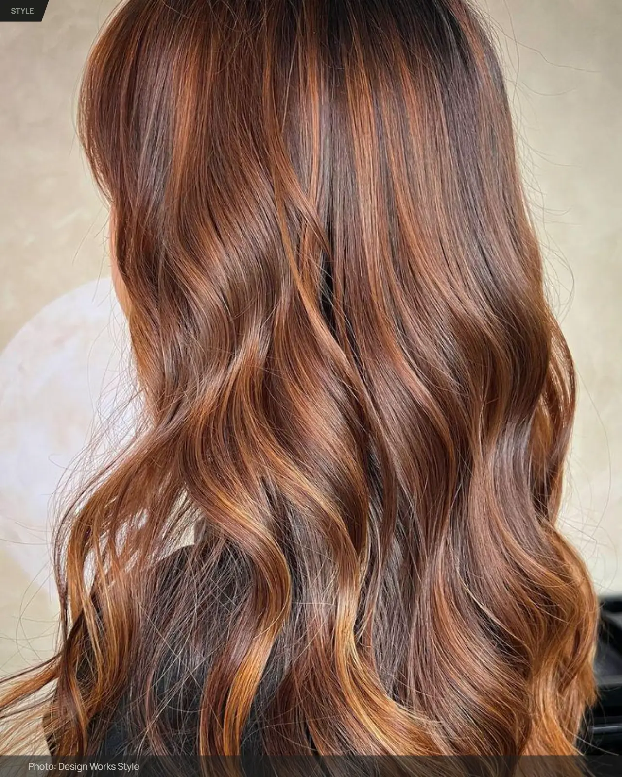 Copper balayage with warm copper pieces blended through wavy brown hair