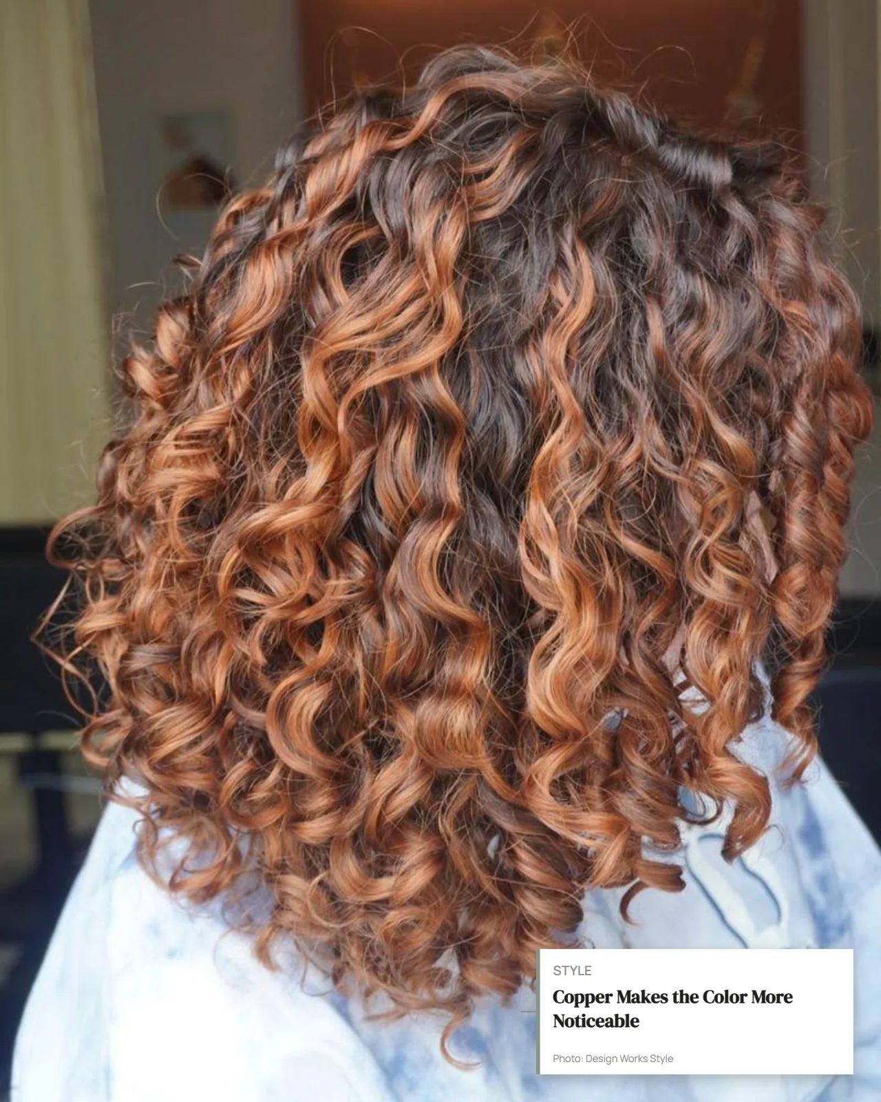 Curly brown hair with warm copper balayage pieces creating visible color variation