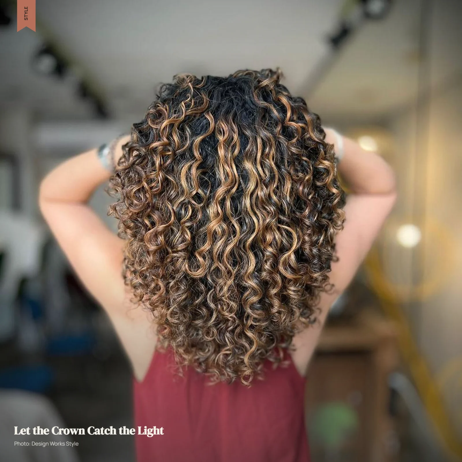 Curly hair with lighter balayage pieces across the crown and outer surface