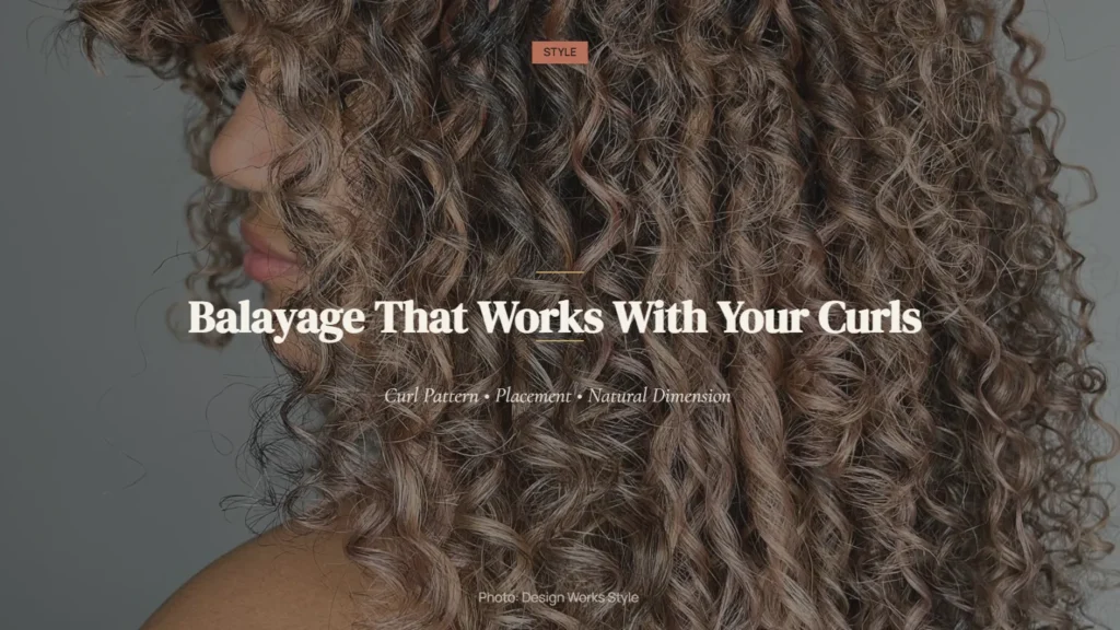 Curly hair with lighter balayage pieces distributed through defined natural curls