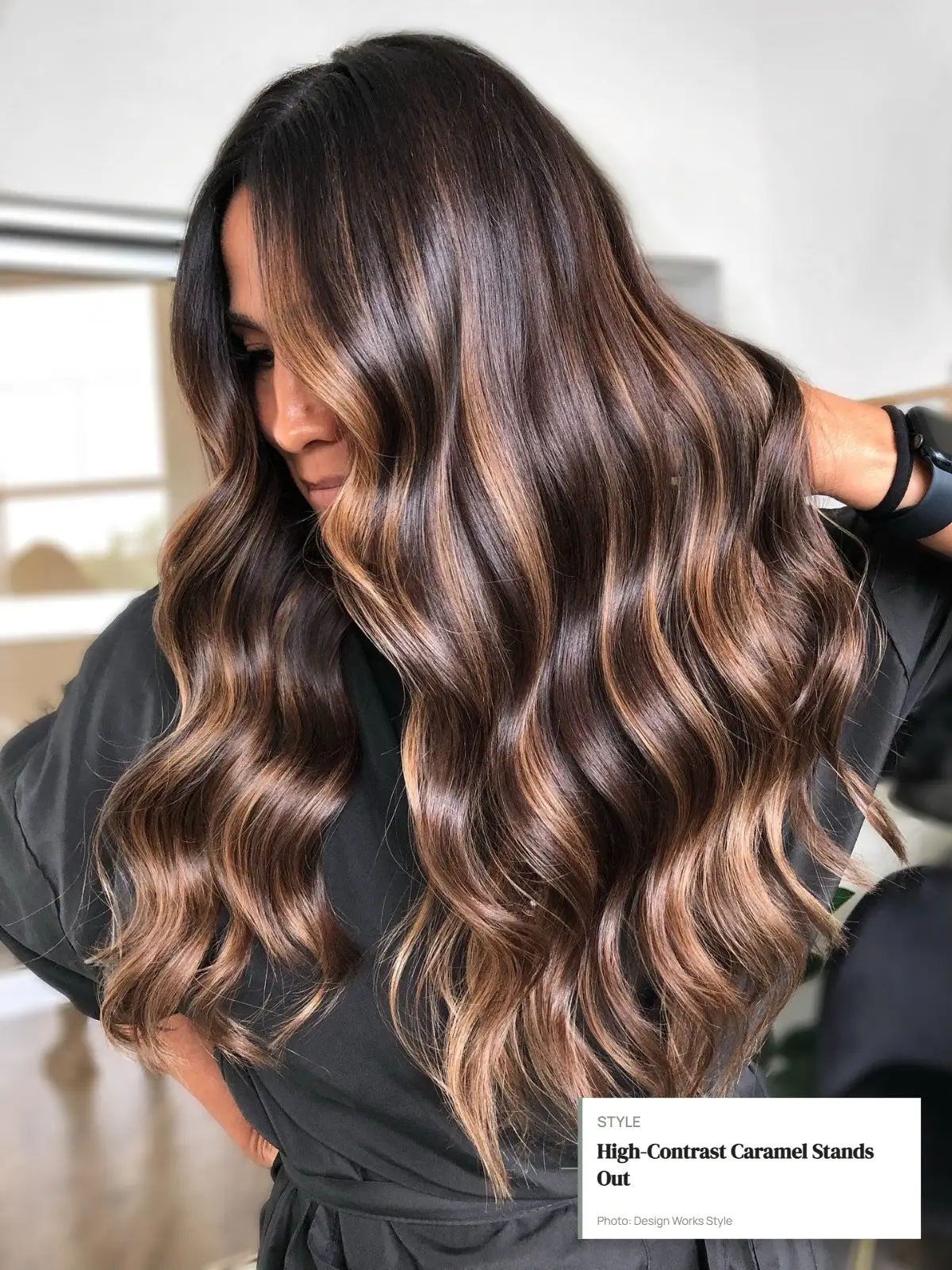 Deep brown hair with noticeably lighter caramel balayage creating strong contrast