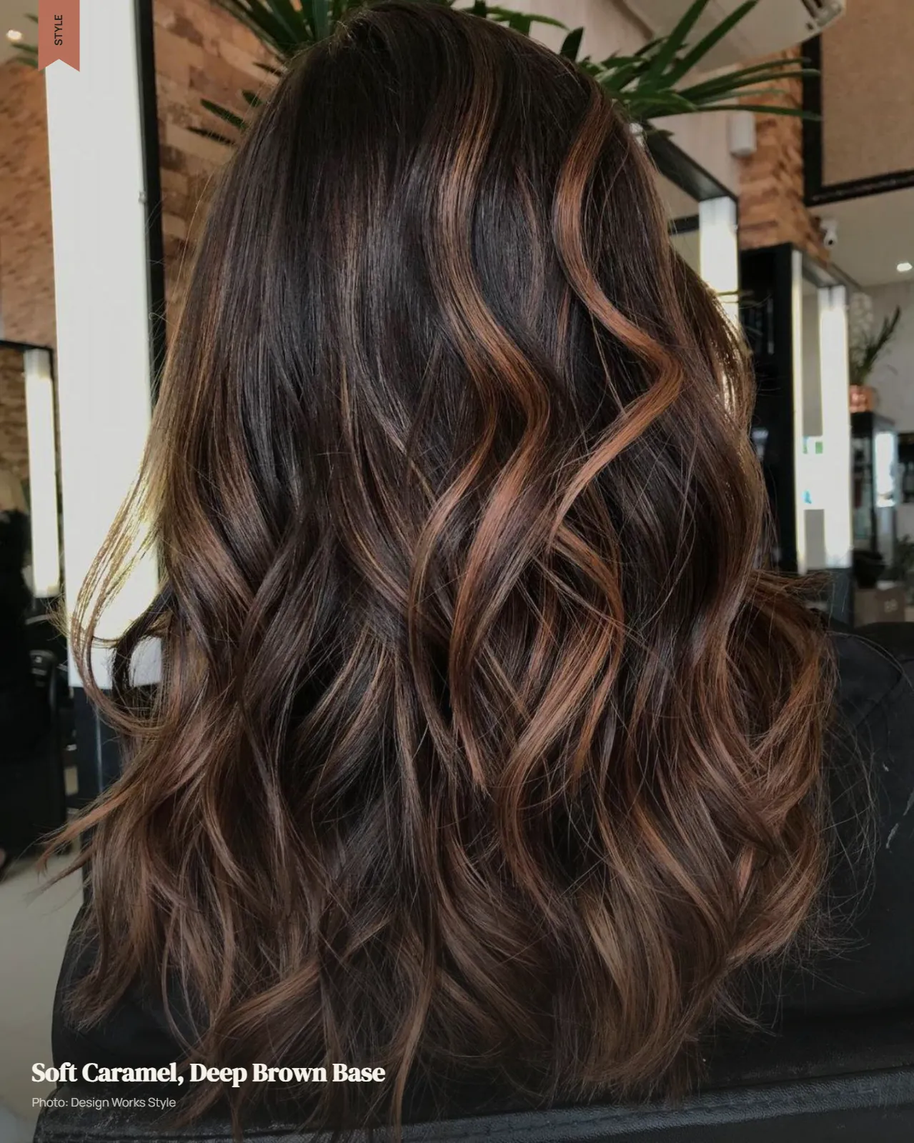 Deep brown hair with soft caramel ribbons creating restrained warm dimension
