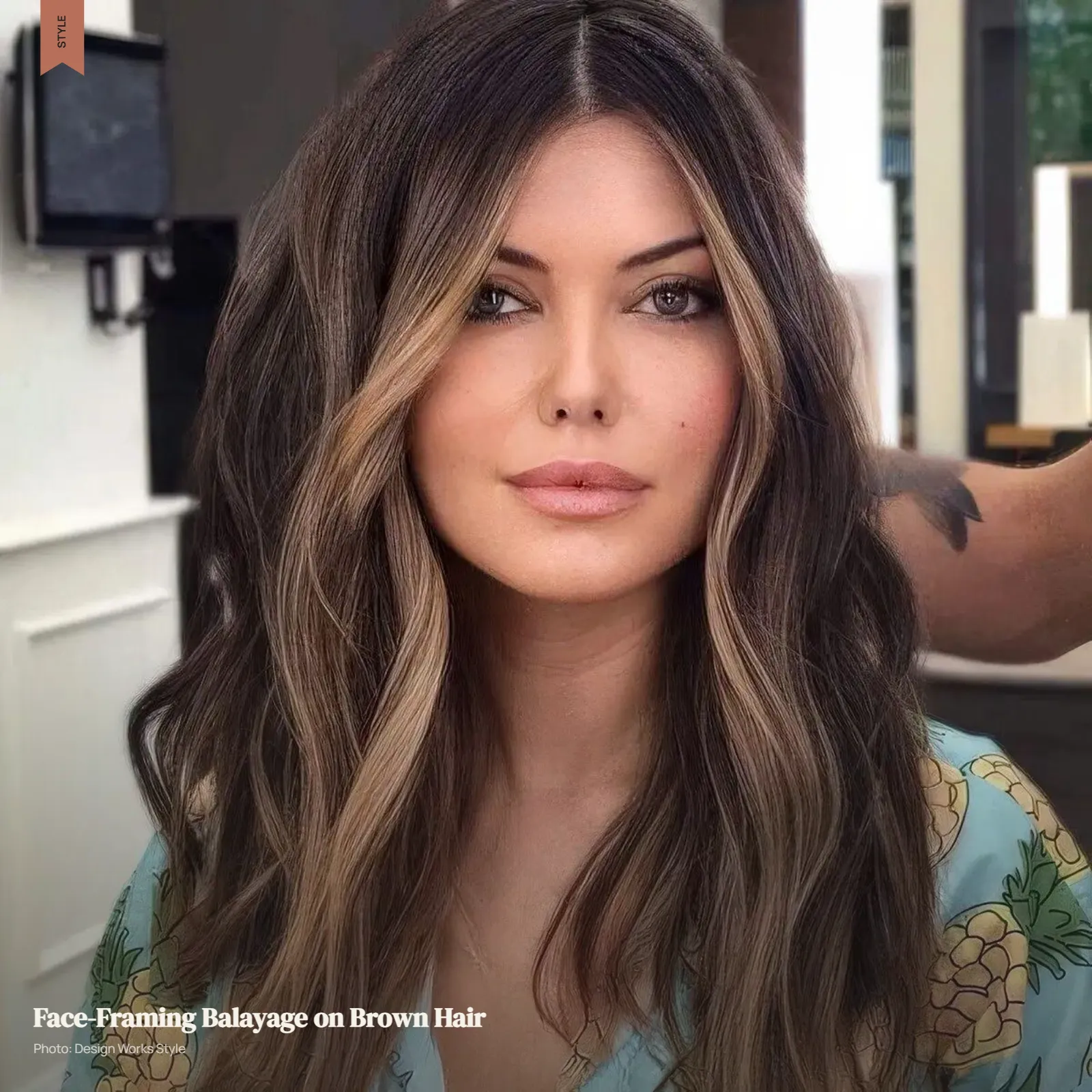 Brown hair with brighter balayage pieces concentrated around the face