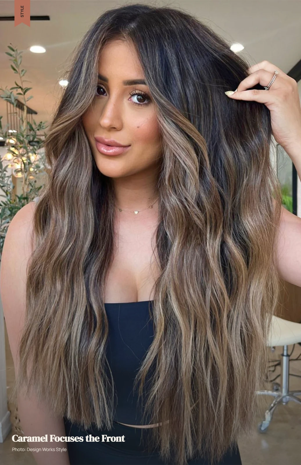 Brunette hair with brighter caramel balayage concentrated around the front sections