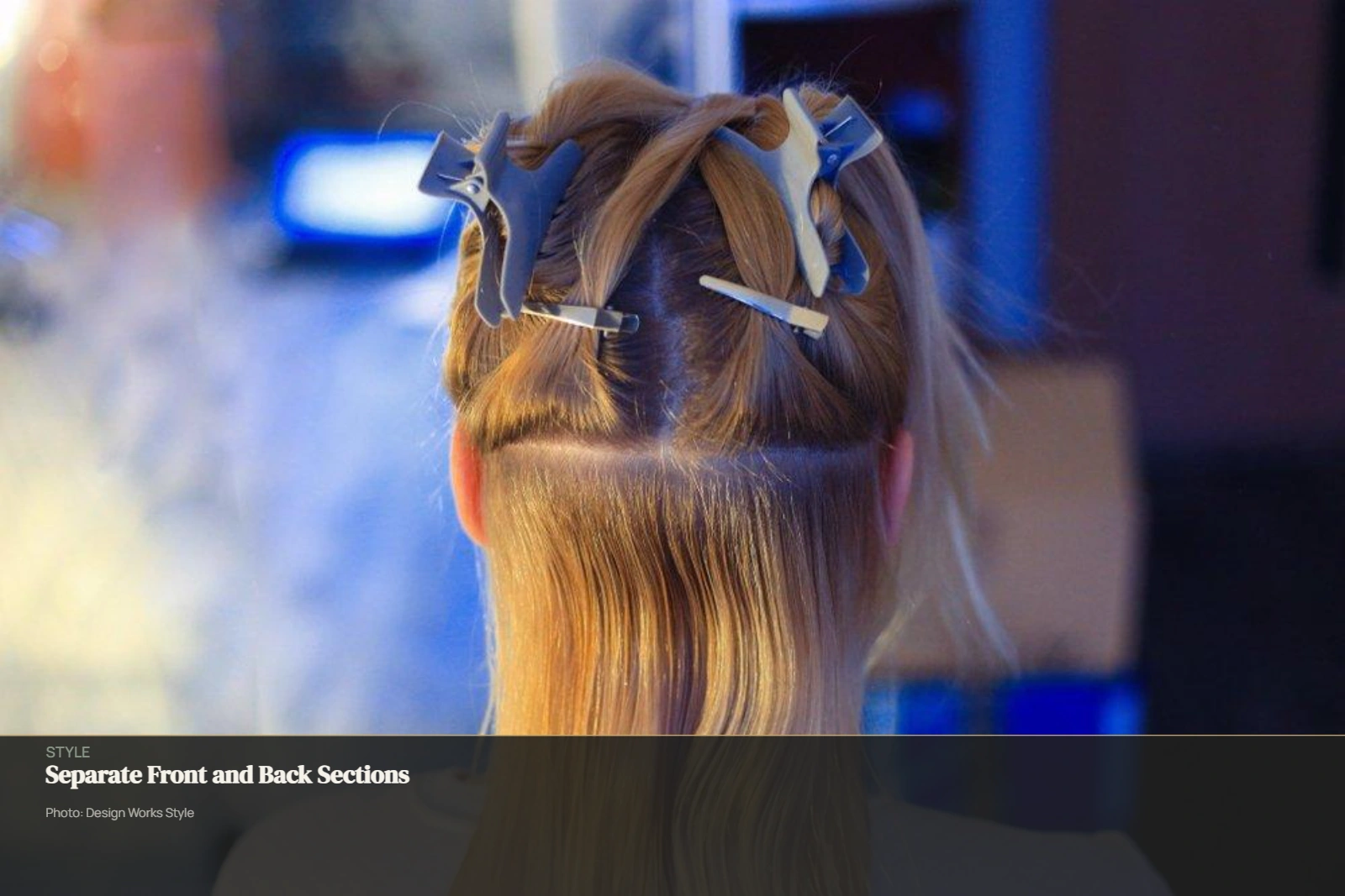 Hair divided into front and back working areas with sections secured by clips