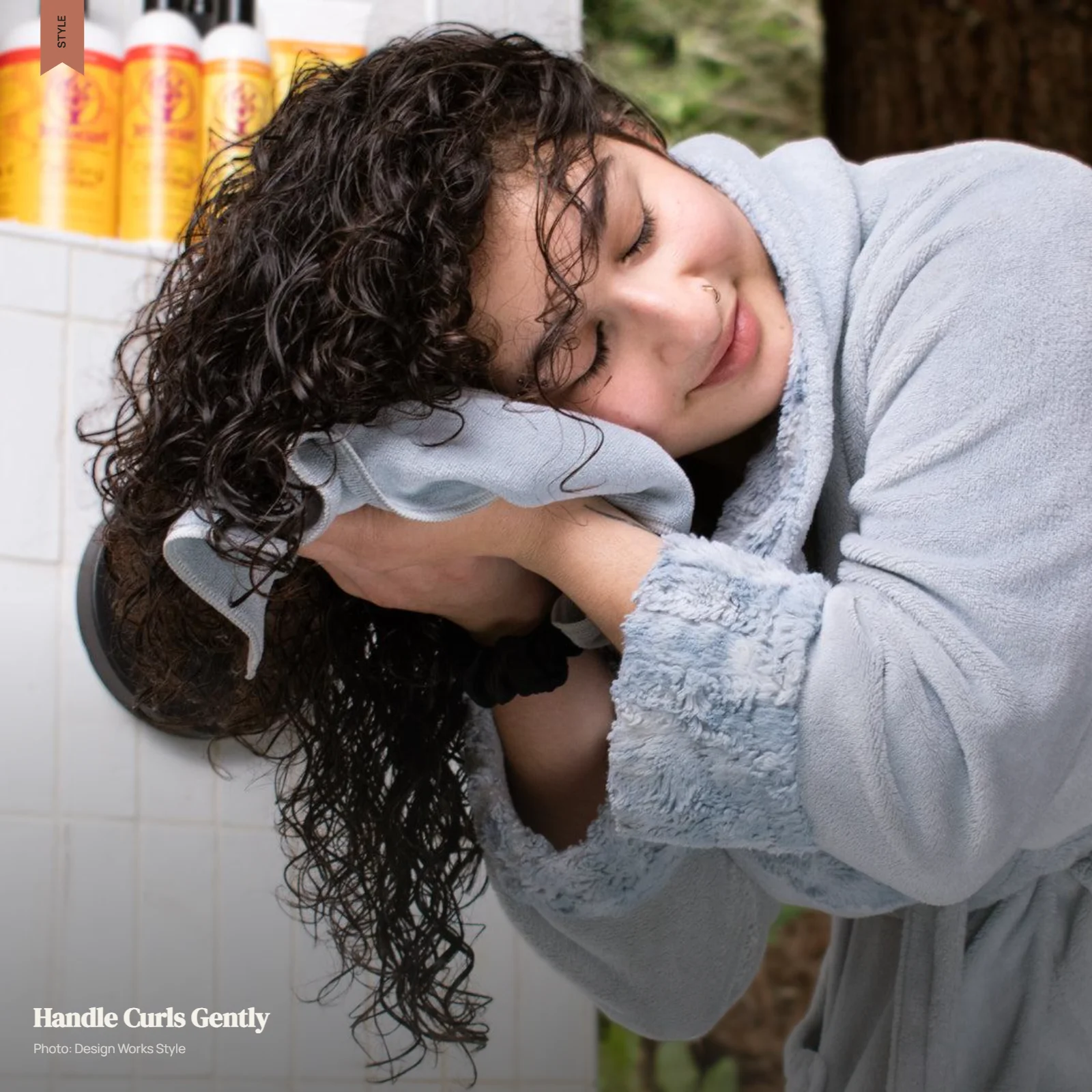 Curly hair being gently dried with a towel without rough rubbing