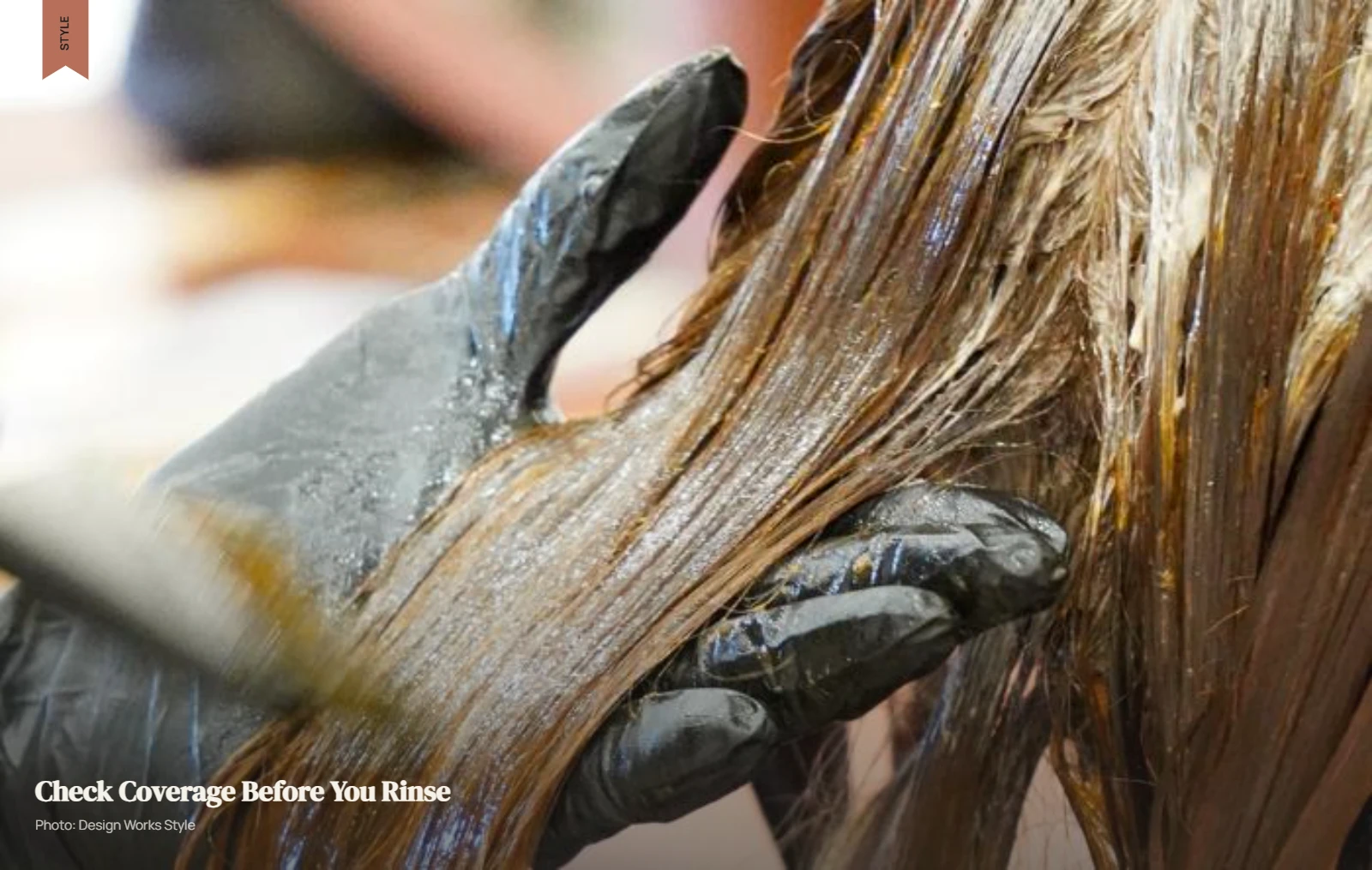 Gloved hand checking evenly saturated hair sections during a gloss application