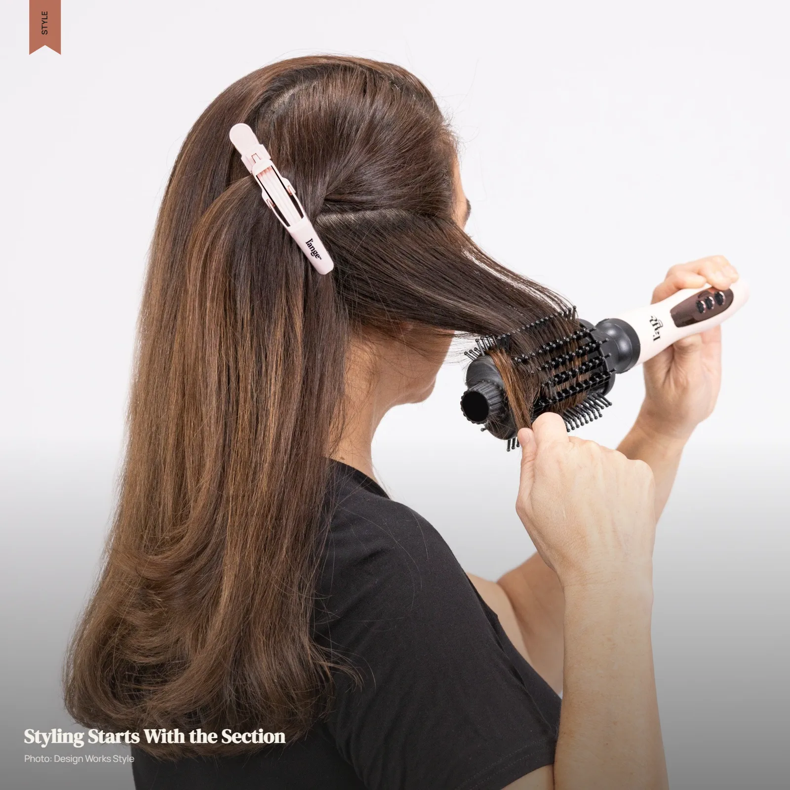 Hands sectioning hair with a comb during a practical at-home styling routine
