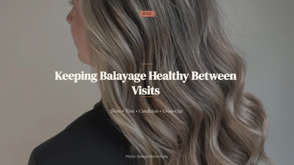 Glossy balayage hair with darker roots, blended lighter lengths, and soft waves