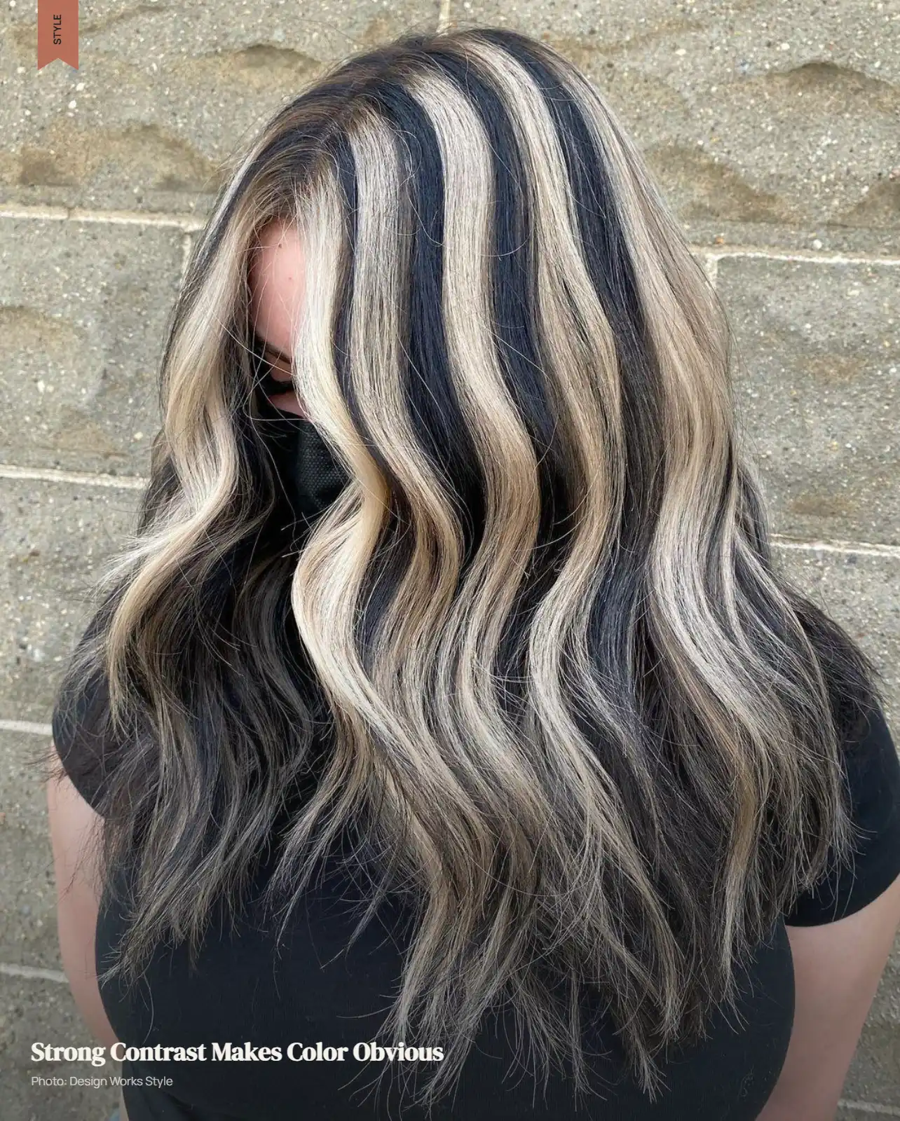 Dark brunette hair with bold, significantly lighter highlights and strong color separation