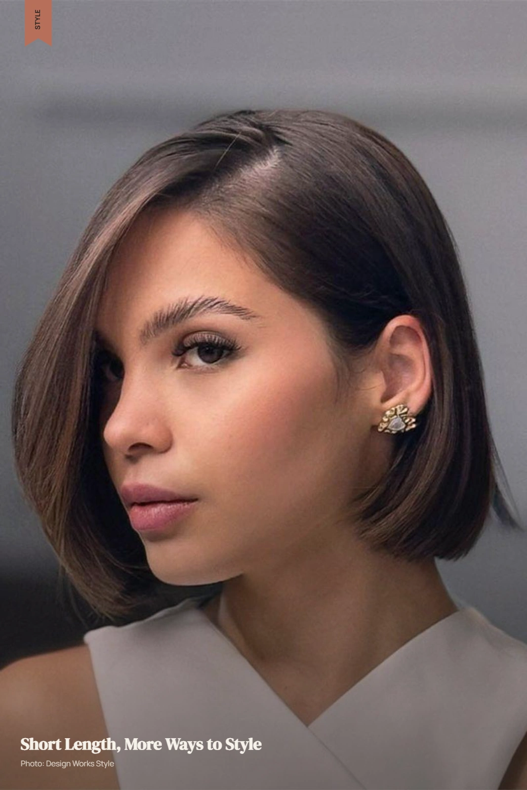 Jaw-length bob with one side tucked behind the ear and soft textured movement