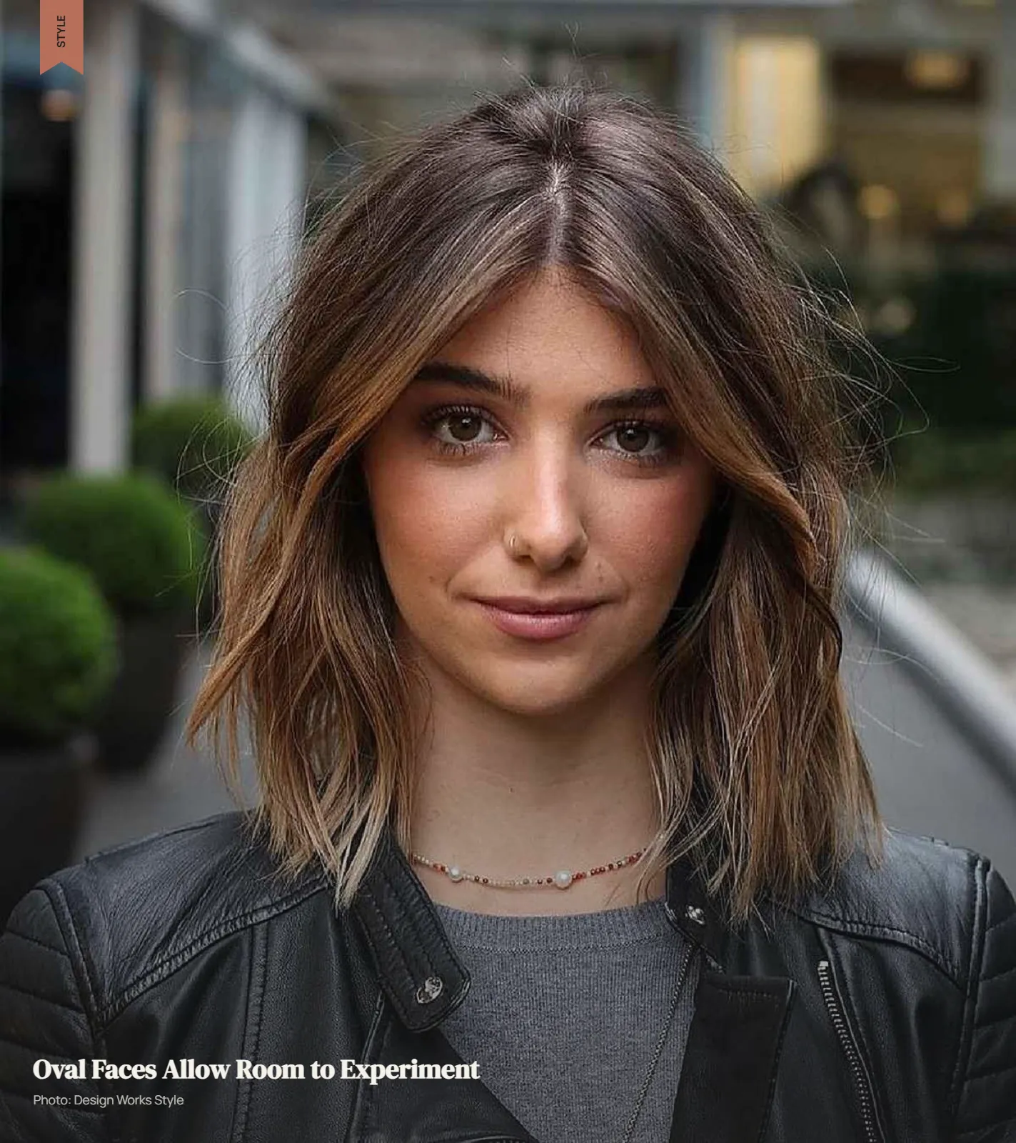 Medium-length layered haircut with face-framing pieces on an oval face