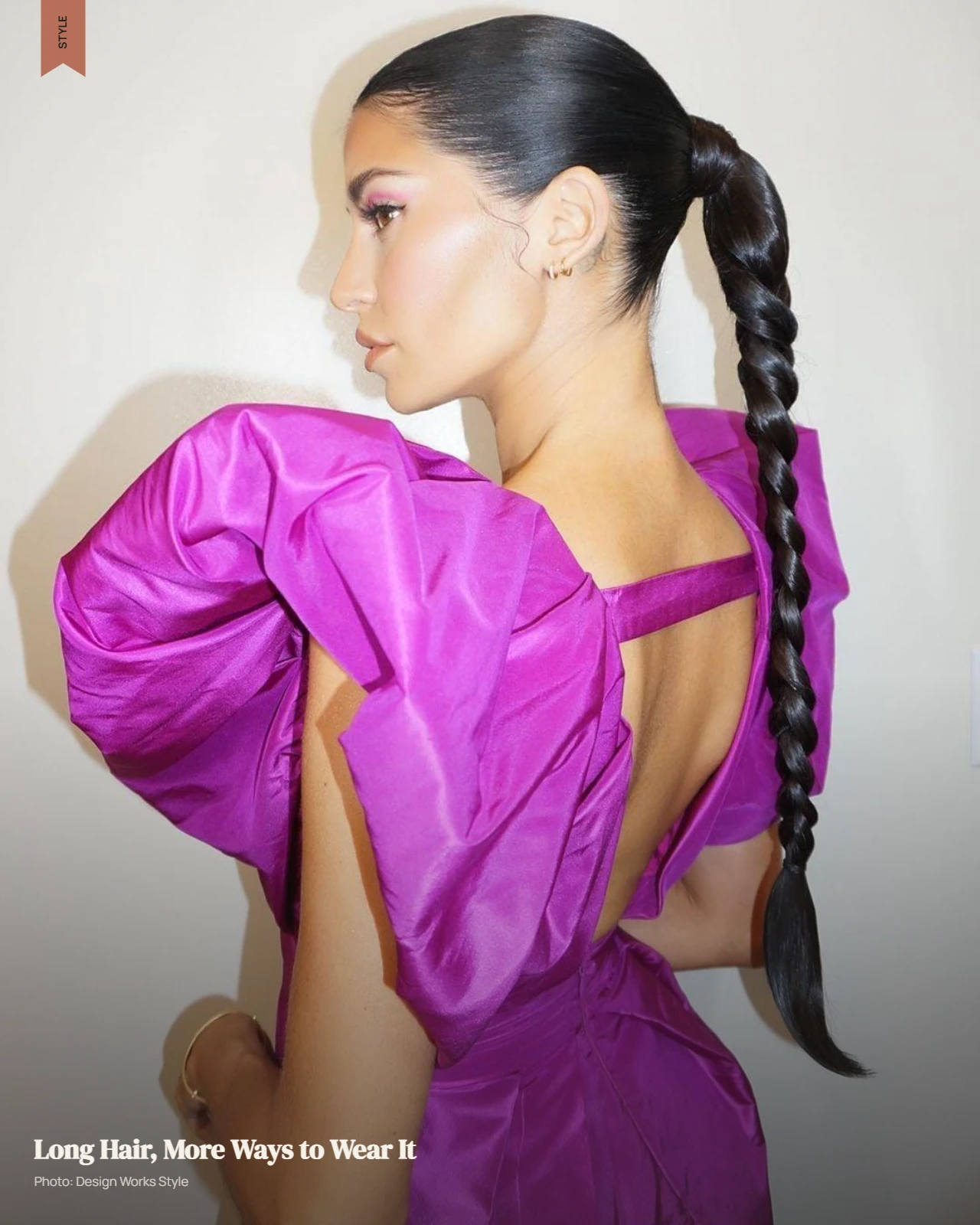 Long hair worn in loose waves with its full length visible below the shoulders