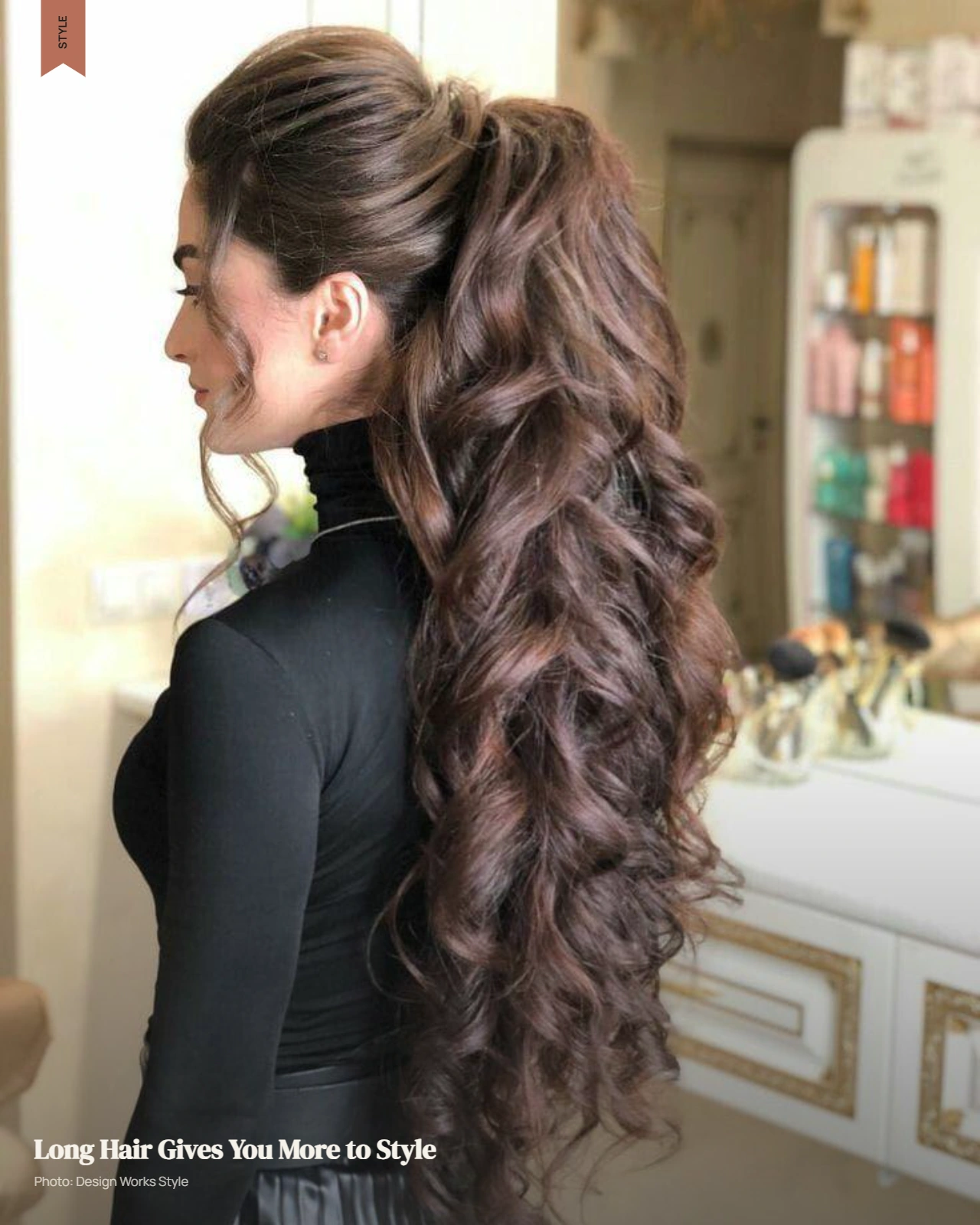 Long layered hair with soft waves extending below the shoulders