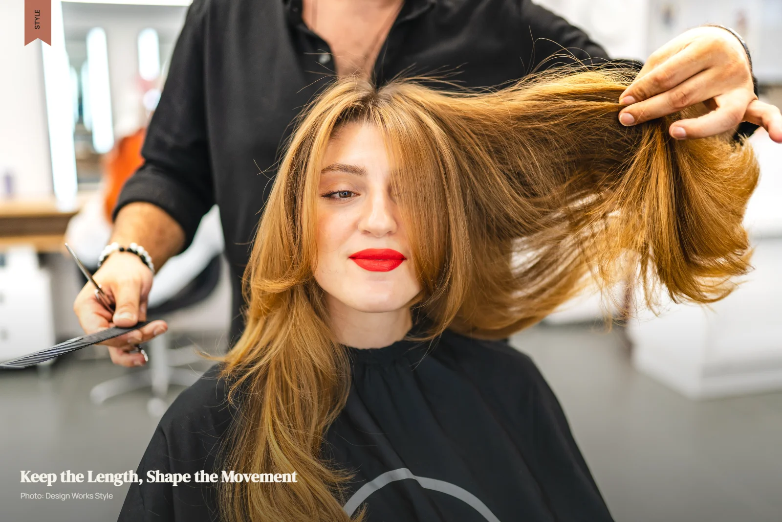 Stylist cutting long layered hair with soft face-framing pieces in a salon