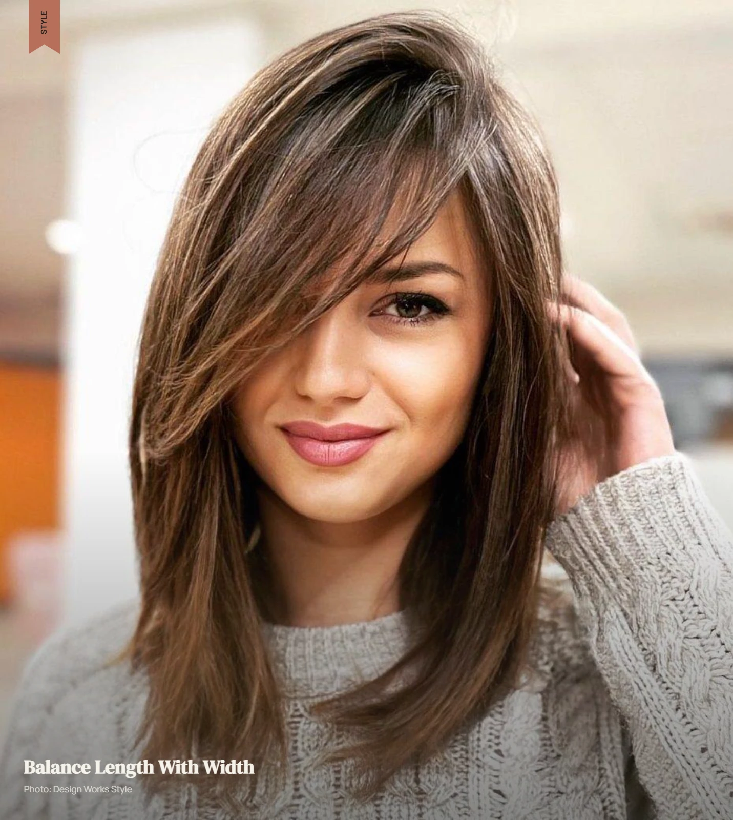 Layered haircut with side volume and face-framing pieces on a long face