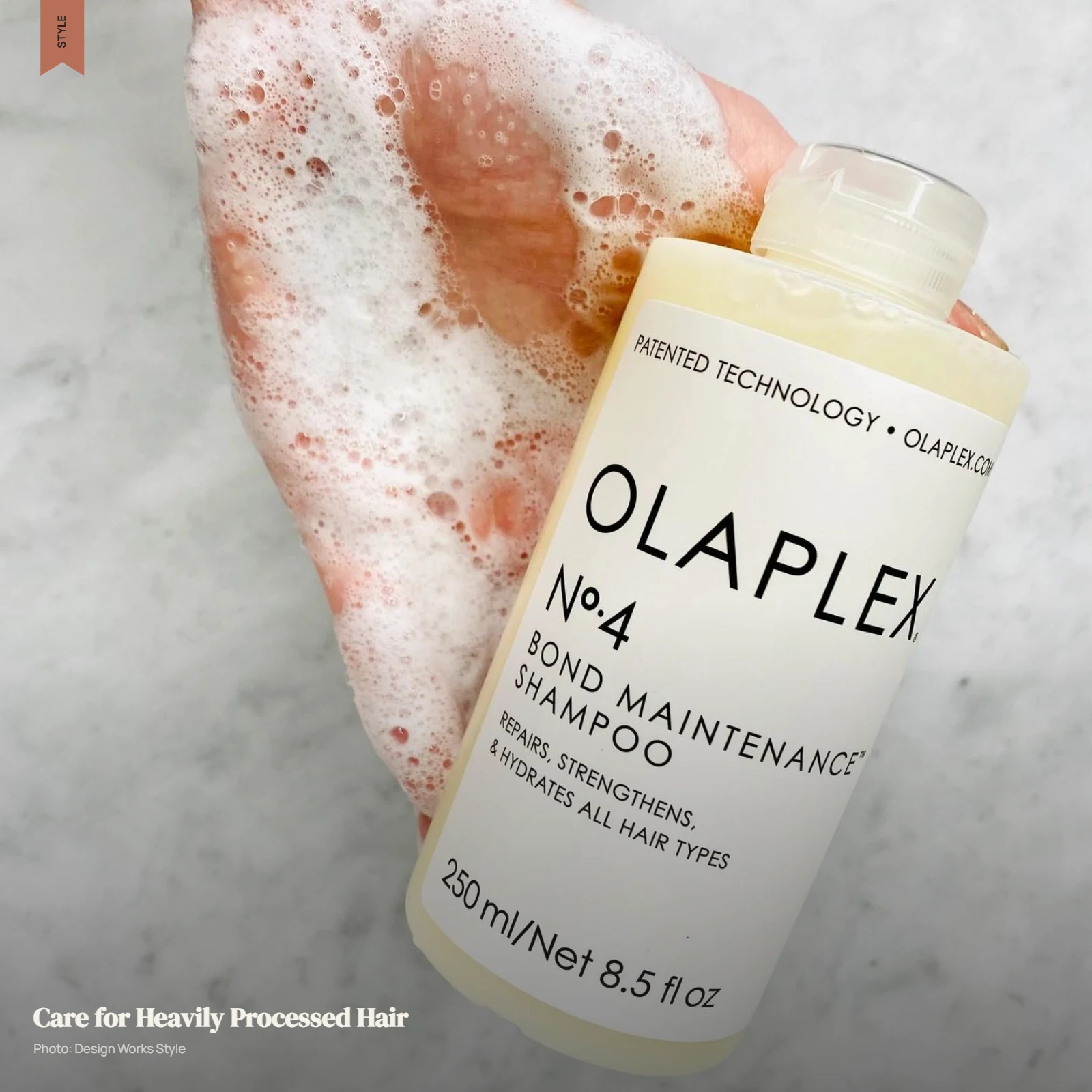 Olaplex No.4 shampoo being worked through balayage hair with lighter processed lengths