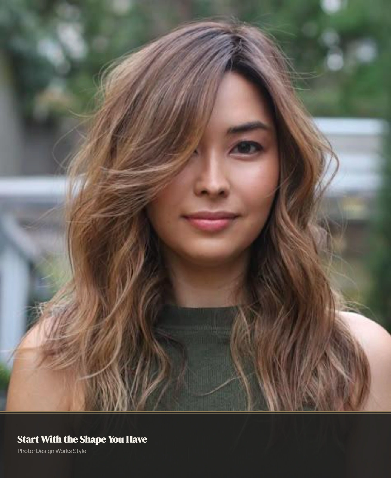 Side-parted hairstyle with crown volume, natural texture, and loose face-framing pieces