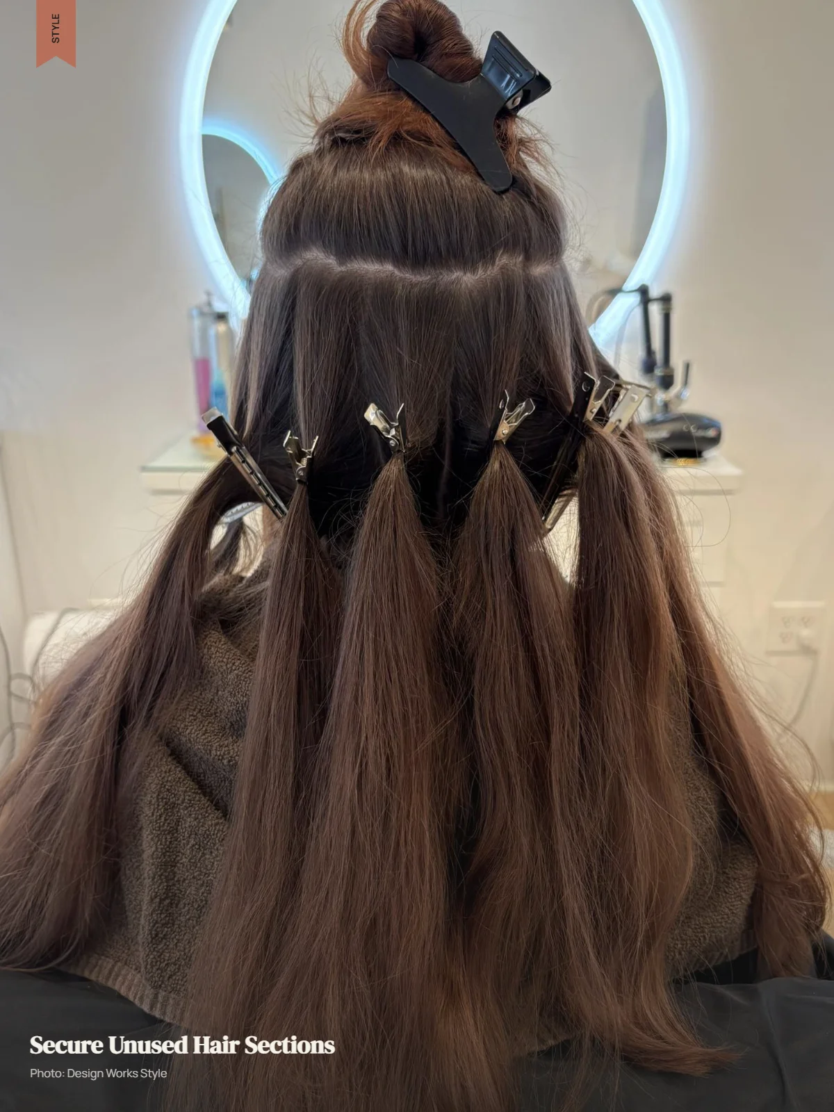 Hair sections secured with clips while one area remains clear for highlighting