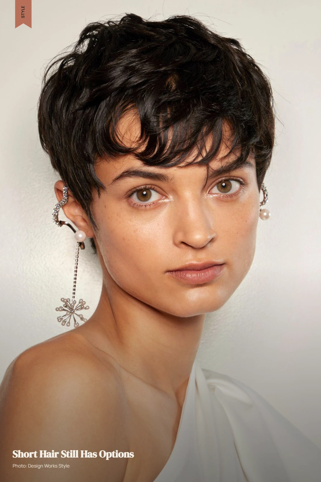 Short textured pixie with directional fringe and volume through the crown