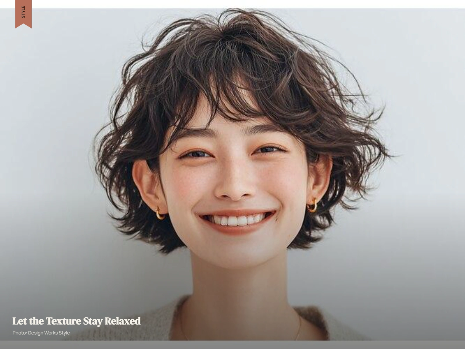 Short tousled haircut with soft waves and an intentionally relaxed finish