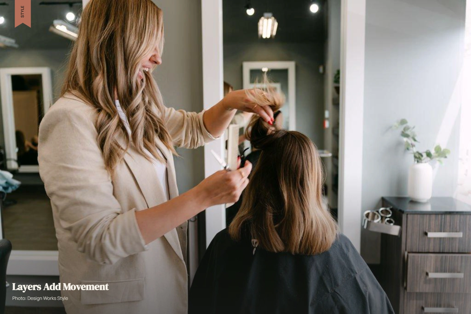 Stylist cutting a shoulder-length layered haircut with visible movement through the ends