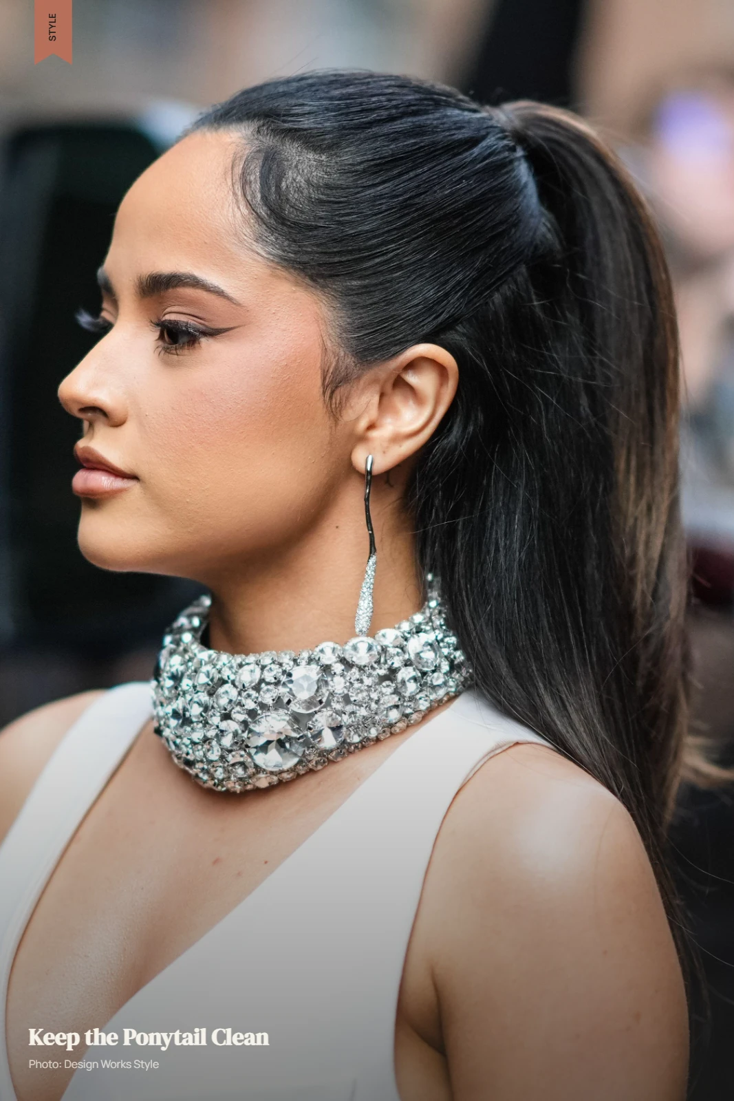 Sleek mid-height ponytail with smooth front sections and a controlled finish