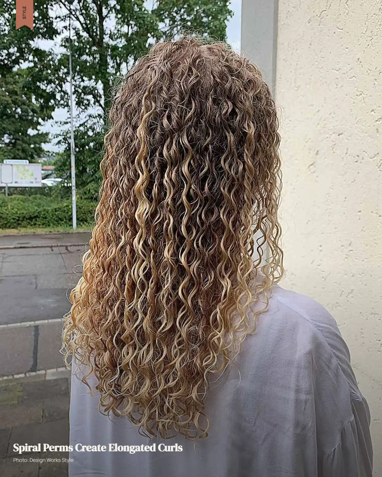 Long hair with defined elongated spiral curls falling vertically from the roots