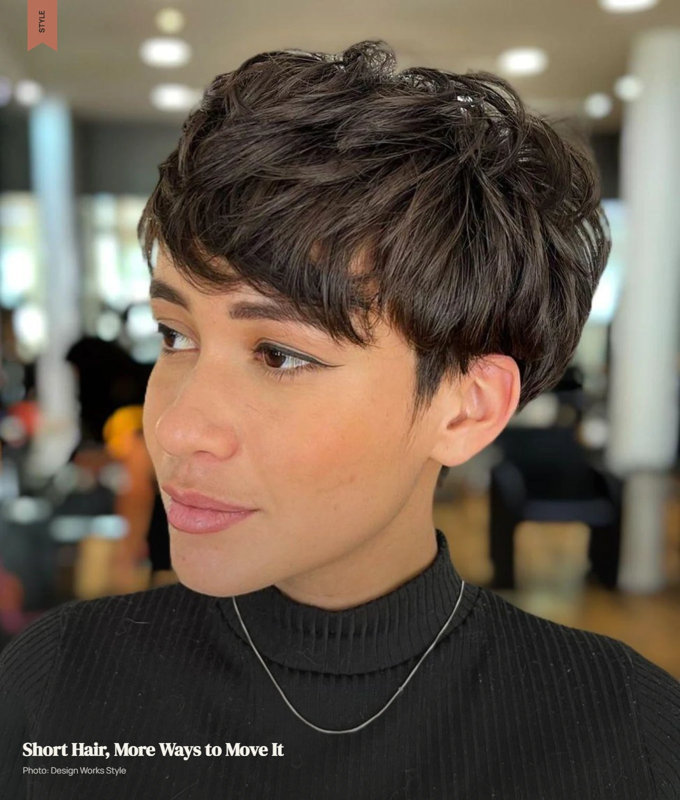Short textured hair styled to one side with controlled crown height and movement