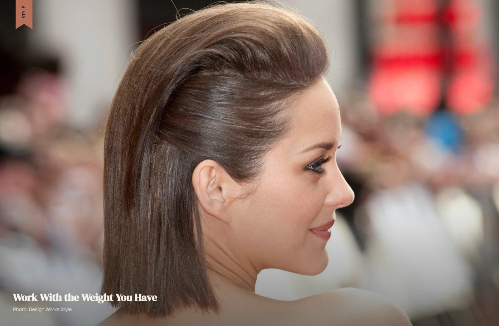Thick hair with smoothed sides and controlled volume directed through the crown