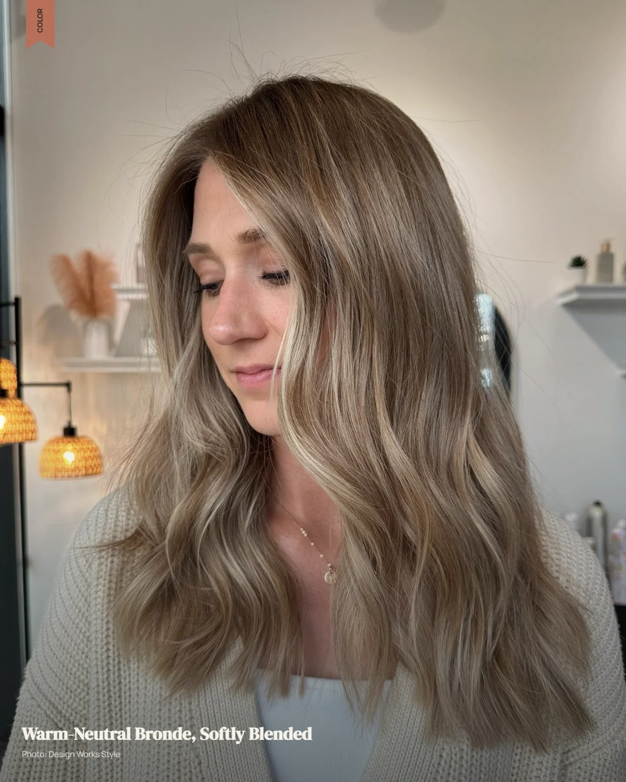 Warm-neutral bronde hair with soft beige and golden dimension in natural light