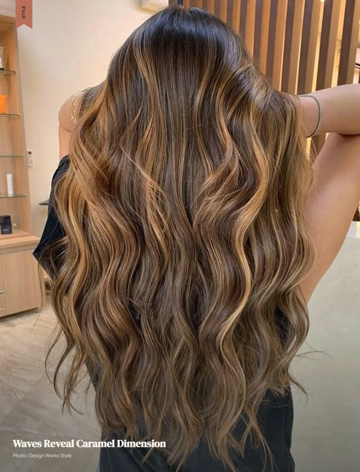 Wavy brown hair with caramel balayage pieces following the natural bends and movement