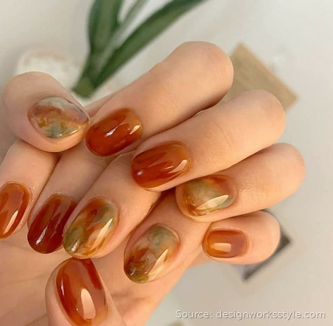 Translucent apple cider jelly fall nails with amber marble accents