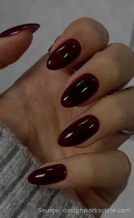 Glossy black cherry November nails on almond shape