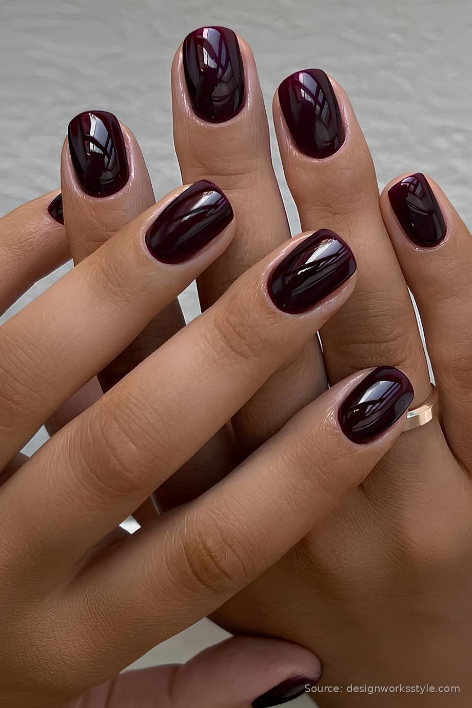 Glossy black cherry winter nails on short oval nails
