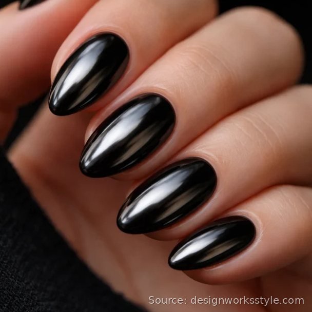 Black chrome nails with a dark glossy mirror finish