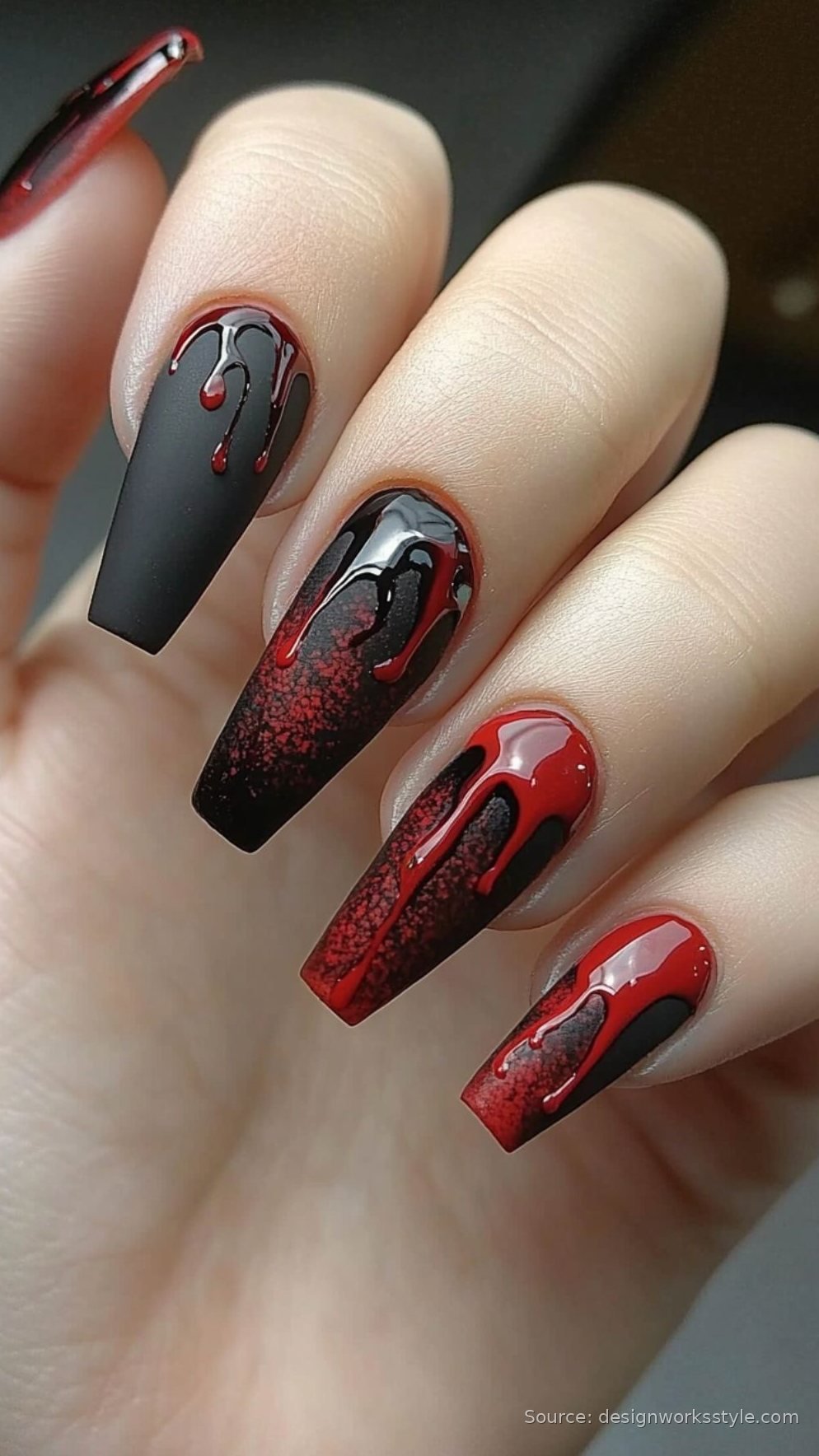 Bloody red drip nail art on long black coffin nails