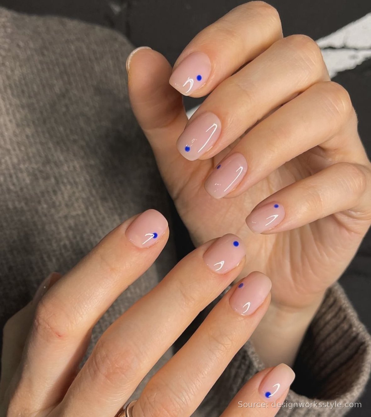 Tiny blue dot nail art on nude short nails