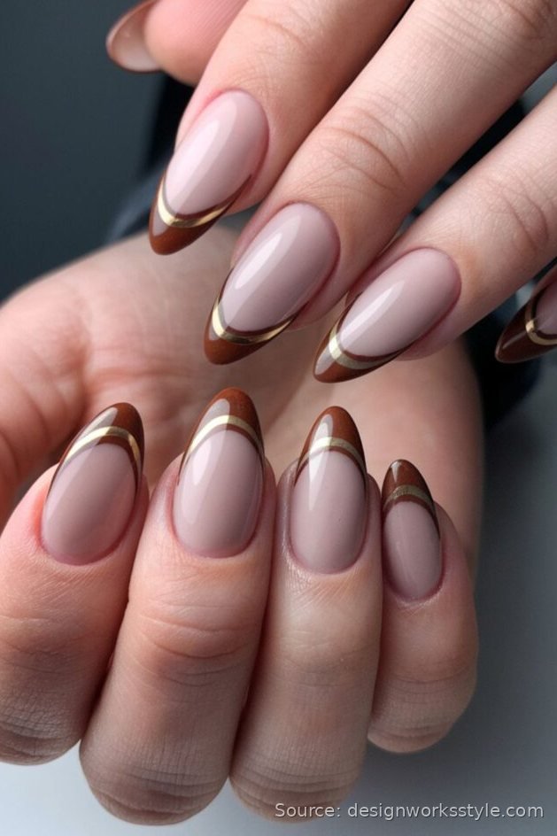 Brown French tip nails outlined with a gold line